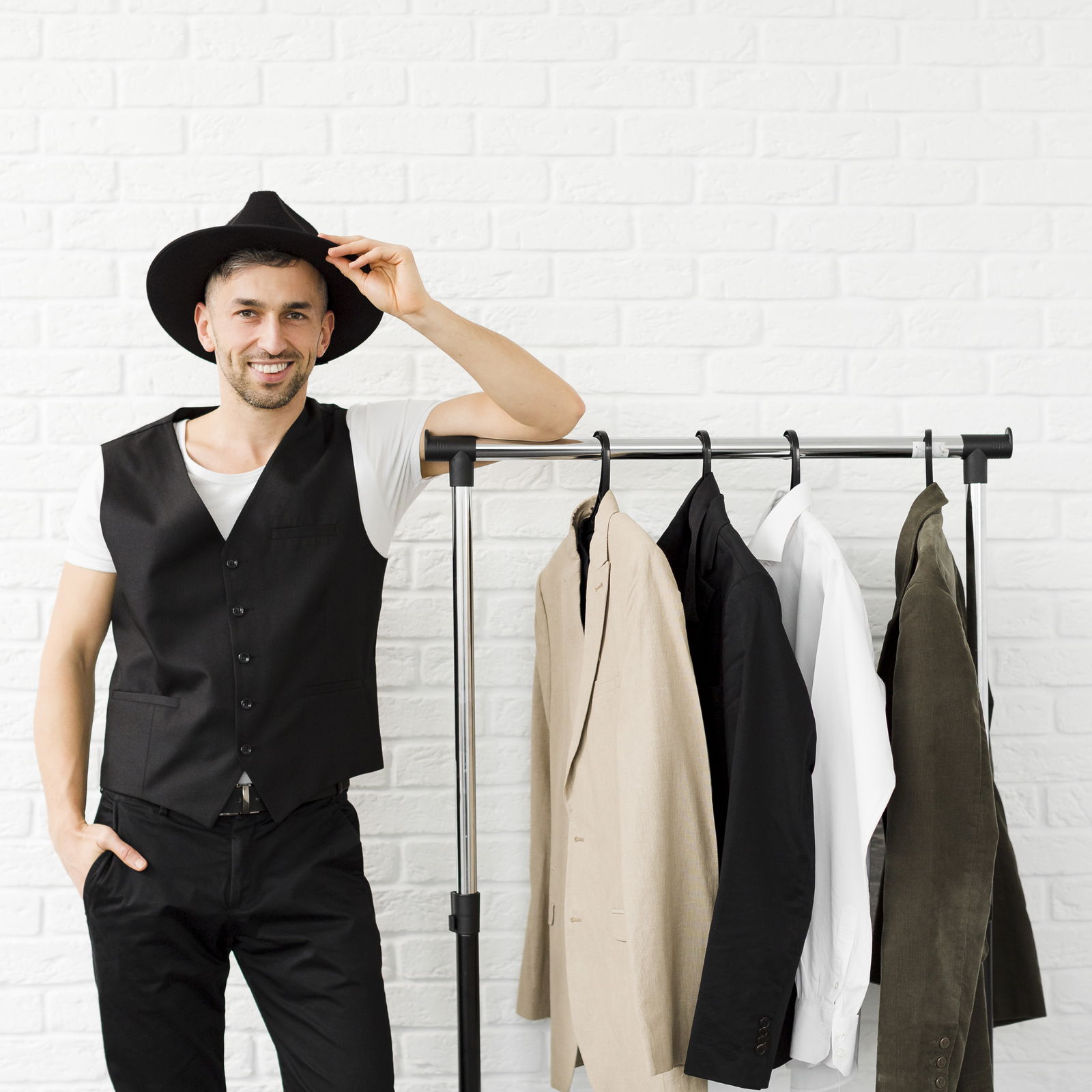 stylish-man-wearing-hat-standing-wardrobe