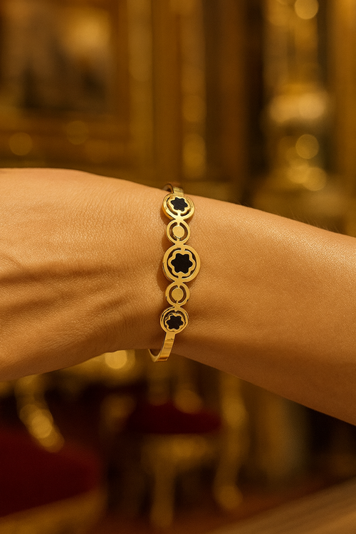 Minimalistic floral pattern with black enamel filling Image