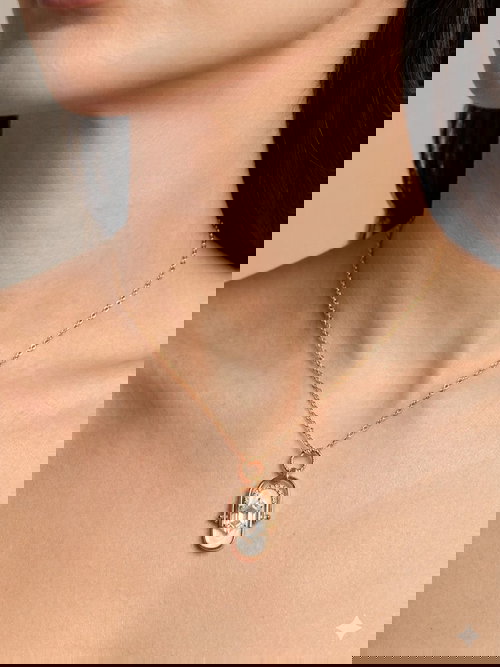 Elegant Gold-Tone Pendant Necklace with Stone and Pearl Accents Image