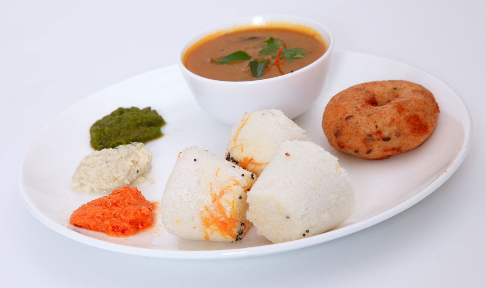 Idlis steamed rice cakes Image 