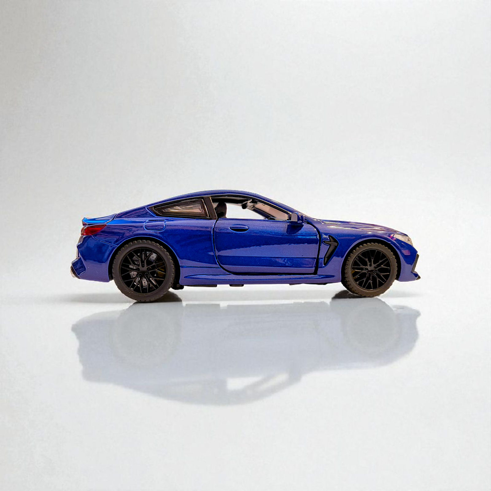BMW M8 1:32 Diecast Model Car | Pull Back Toy with Lights, Sound & Openable Doors Image