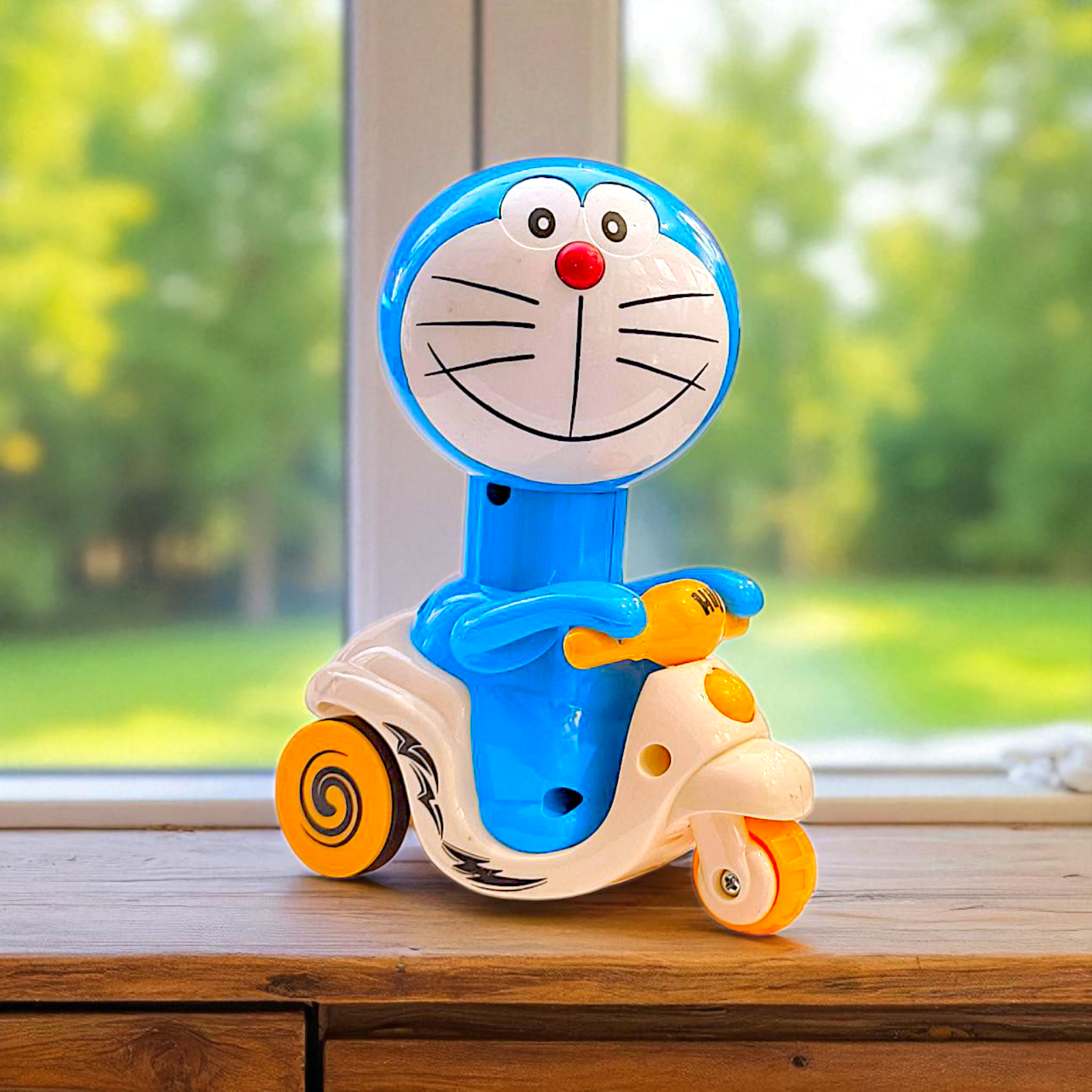 Smiling Doremon Press N Go Scooter Toy – Smooth Ride Fun for Kids Image