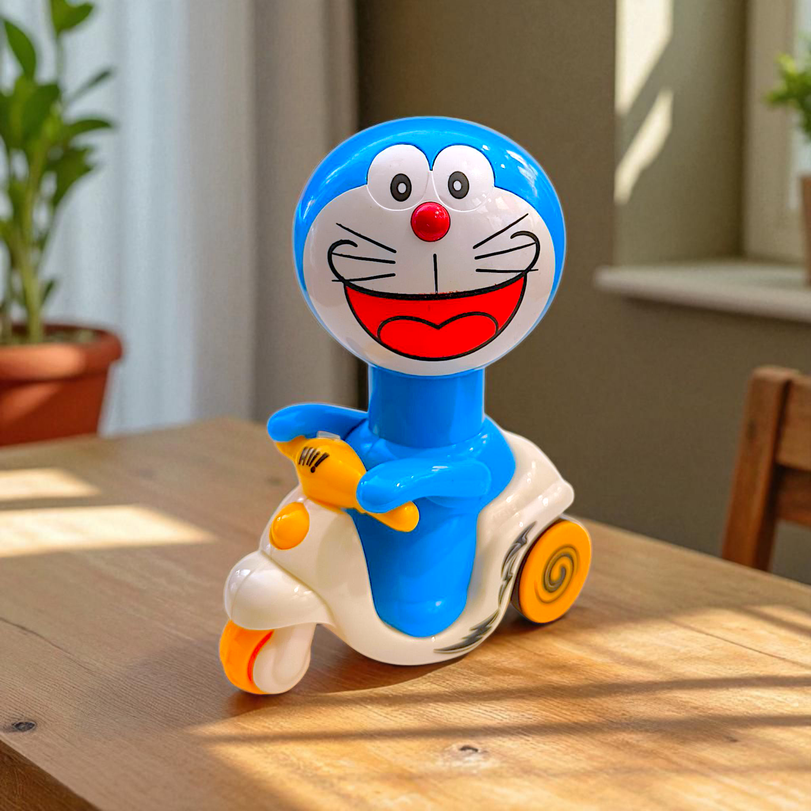 Laughing Doremon Press N Go Scooter Toy – Joyful Ride for Kids Image