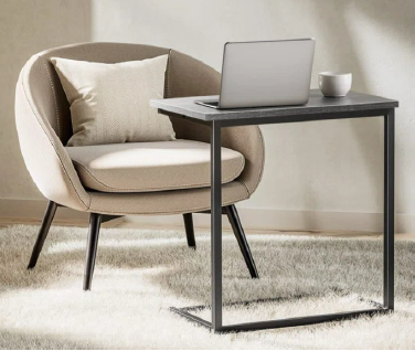 Modern wooden coffee table with a cup of coffee